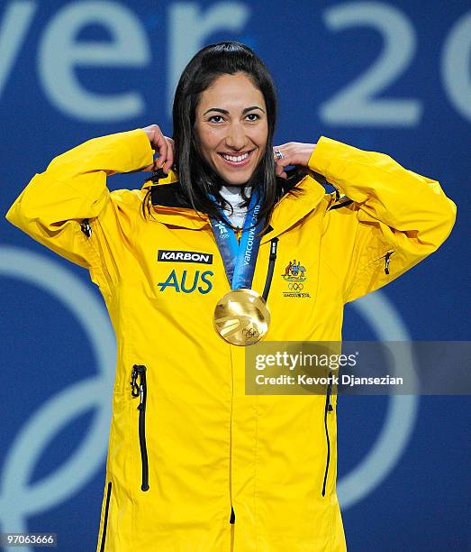 Lydia Lassila of Australia celebrates receiving the gold medal during the medal ceremony for the ladies' aerials freestyle skiing on day 14 of the...