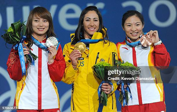 Li Nina of China receives the silver medal, Lydia Lassila of Australia receives the gold medal and Guo Xinxin of China receives the bronze medal...