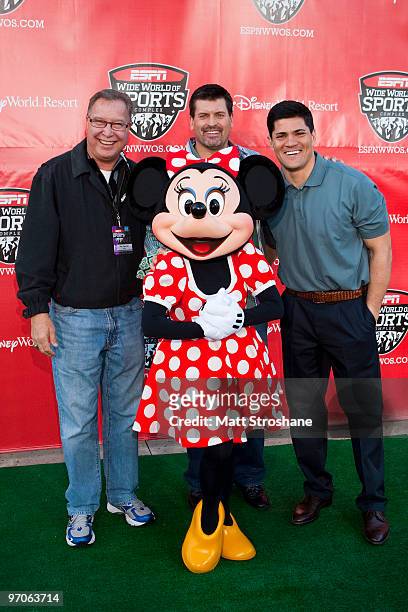 Personalities Ron Jaworski, Mark Schlereth, and Tedy Bruschi walk the red carpet with Minnie Mouse at the official relaunch of the ESPN Wide World of...