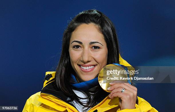 Lydia Lassila of Australia celebrates receiving the gold medal during the medal ceremony for the ladies' aerials freestyle skiing on day 14 of the...