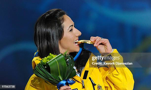 Lydia Lassila of Australia celebrates receiving the gold medal during the medal ceremony for the ladies' aerials freestyle skiing on day 14 of the...