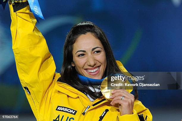 Lydia Lassila of Australia celebrates receiving the gold medal during the medal ceremony for the ladies' aerials freestyle skiing on day 14 of the...