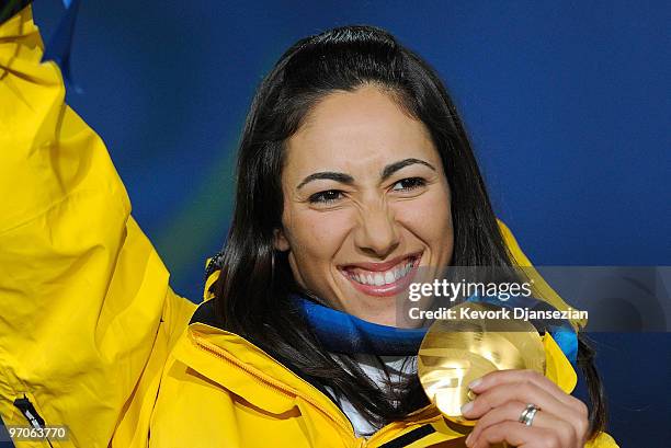 Lydia Lassila of Australia celebrates receiving the gold medal during the medal ceremony for the ladies' aerials freestyle skiing on day 14 of the...