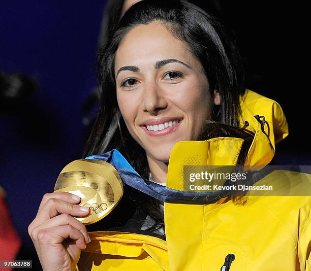 Lydia Lassila of Australia celebrates receiving the gold medal during the medal ceremony for the ladies' aerials freestyle skiing on day 14 of the...