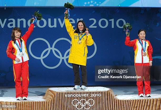 Li Nina of China receives the silver medal, Lydia Lassila of Australia receives the gold medal and Guo Xinxin of China receives the bronze medal...