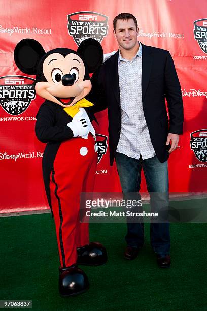 Jason Whitten, tight end for the Dallas Cowboys, walks the red carpet with Mickey Mouse at the official relaunch of the ESPN Wide World of Sports at...