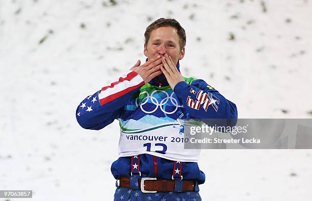 Jeret Peterson of the United States celebrates winning the silver medal during the freestyle skiing men's aerials final on day 14 of the Vancouver...