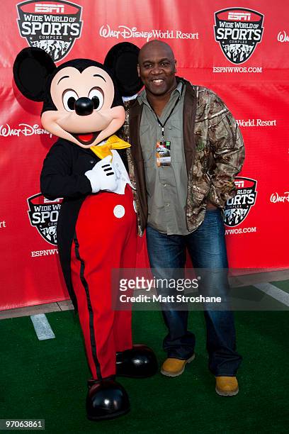 Former Buffalo Bill Thurman Thomas walks the red carpet with Mickey Mouse at the official relaunch of the ESPN Wide World of Sports at Walt Disney...