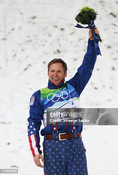 Jeret Peterson of the United States celebrates winning the silver medal during the freestyle skiing men's aerials final on day 14 of the Vancouver...