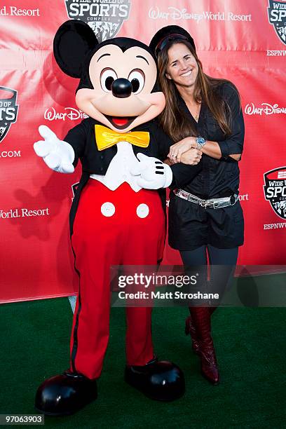 Soccer player Brandi Chastain walks the red carpet with Mickey Mouse at the official relaunch of the ESPN Wide World of Sports at Walt Disney World...