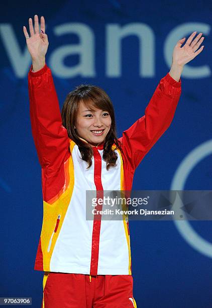 Li Nina of China celebrates receiving the silver medal during the medal ceremony for the ladies' aerials freestyle skiing on day 14 of the Vancouver...