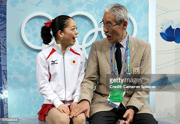 Akiko Suzuki of Japan sits in the kiss and cry area with coach Hiroshi Nagakubo in the Ladies Free Skating on day 14 of the 2010 Vancouver Winter...