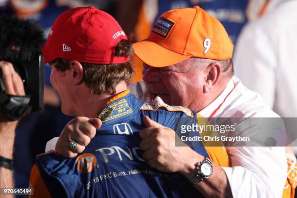 Scott Dixon, driver of the PNC Bank Chip Ganassi Racing Honda, and team owner Chip Ganassi celebrate in Victory Lane after winning the Verizon...