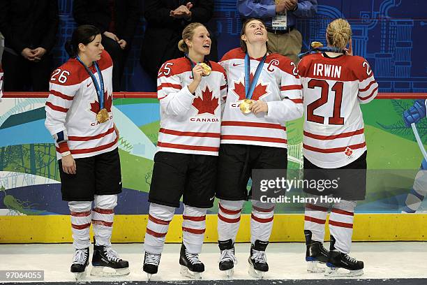 Team Canada celebrate with the gold medals following their 2-0 victory during the ice hockey women's gold medal game between Canada and USA on day 14...