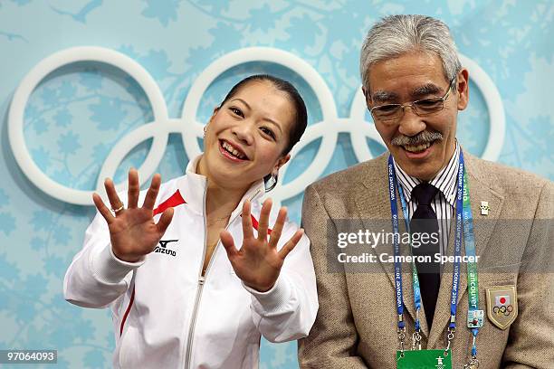 Akiko Suzuki of Japan sits in the kiss and cry area with coach Hiroshi Nagakubo in the Ladies Free Skating on day 14 of the 2010 Vancouver Winter...