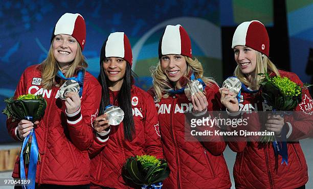Team Canada celebrates receiving the silver medal during the medal ceremony for the ladies' 3000 m relay short track on day 14 of the Vancouver 2010...