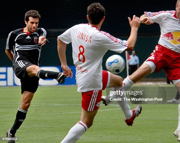 June 2007 CREDIT: Katherine Frey / TWP. Washington, DC. DC United vs. NY Red Bulls Ben Olsen connects and scores between two NY Red Bulls defenders...