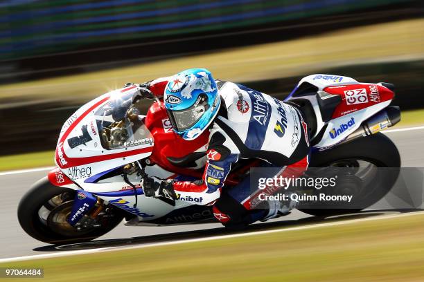 Carlos Checa of Spain and the Althea Racing Team rounds the bend during practice ahead of round one for the Superbike World Championship at Phillip...