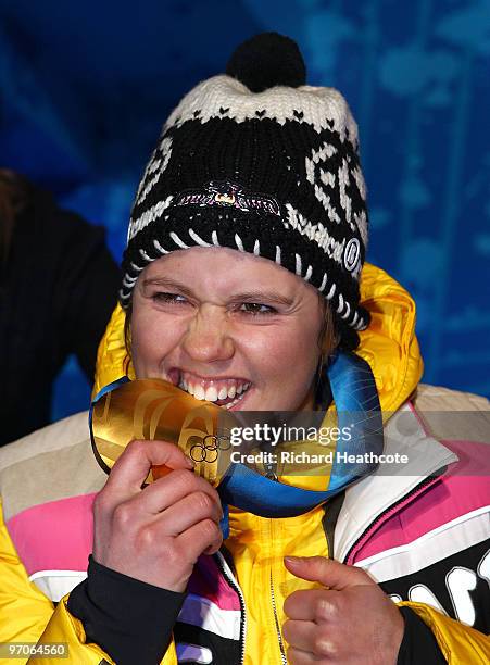 Viktoria Rebensburg of Germany celebrates receiving the gold medal and during the medal ceremony for the women's giant slalom alpine skiing on day 14...