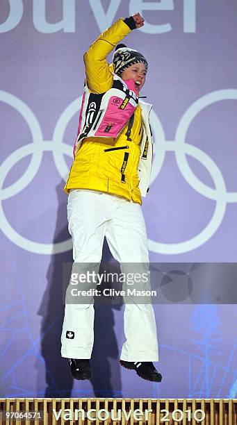 Viktoria Rebensburg of Germany celebrates receiving the gold medal and during the medal ceremony for the women's giant slalom alpine skiing on day 14...