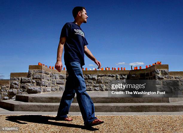 VTGrads Photos by Michael Williamson NEG#190519 5/8/07: Chris Poch walks in front of the steps at Burrus Hall where he led prayers in the days after...