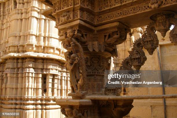 the walls of jain temple in jaisalmer fort, india - haveli stock pictures, royalty-free photos & images