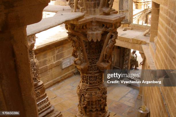 sandstone columns and artistic ornate carvings in jain temple in jaisalmer, india - haveli stock pictures, royalty-free photos & images