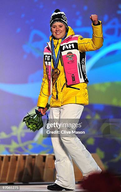 Viktoria Rebensburg of Germany celebrates receiving the gold medal and during the medal ceremony for the women's giant slalom alpine skiing on day 14...