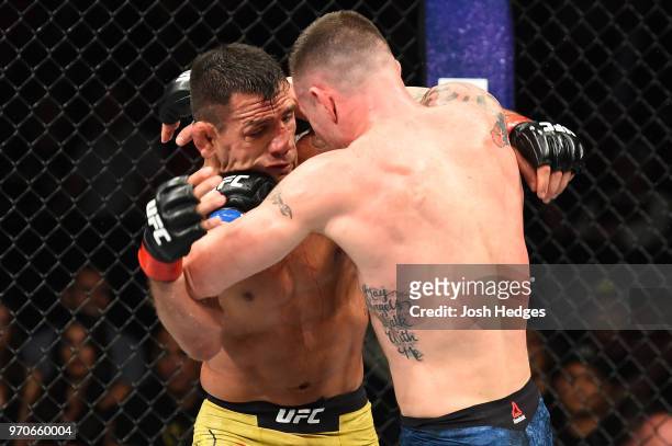 Colby Covington punches Rafael Dos Anjos of Brazil in their interim welterweight title fight during the UFC 225 event at the United Center on June 9,...