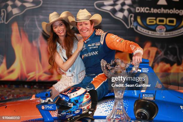 Scott Dixon, driver of the PNC Bank Chip Ganassi Racing Honda, and his wife Emma Davies Dixon celebrate in Victory Lane after winning the Verizon...