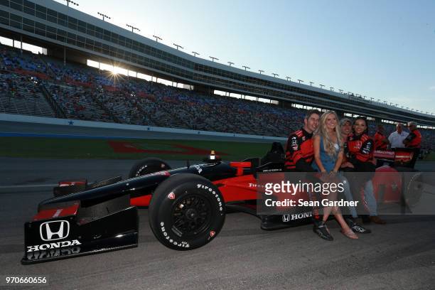 Cody Nickson and Jessica Graf pose for a photo with Arie Luyendyk Jr. And Lauren Burnham prior to the Verizon IndyCar Series DXC Technology 600 at...