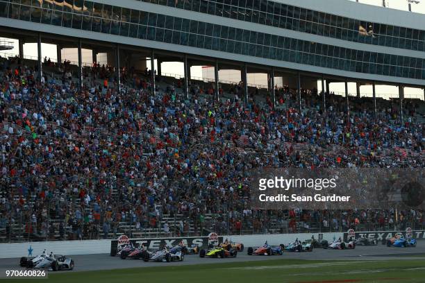 Josef Newgarden, driver of the Verizon Team Penske Chevrolet, leads the field during the Verizon IndyCar Series DXC Technology 600 at Texas Motor...