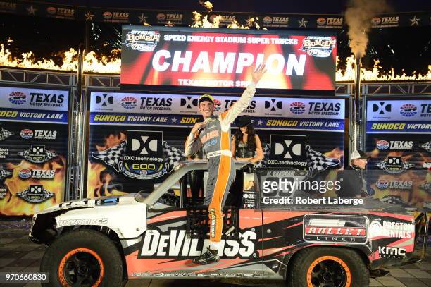 Matt Brabham, driver of the Devilbiss truck poses for a photo in Victory Lane after winning the Speed Energy Stadium Super Trucks Series race at...