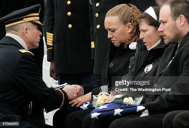 Arlington National Cemetery, VA Brigadier General Rodney Johnson, Office of the Provost Marshall, General of the Army presents a flag to Natasha A....