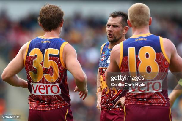 Luke Hodge of the Lions talks to players during the round 12 AFL match between the Brisbane Lions and the Essendon Bombers at The Gabba on June 10,...