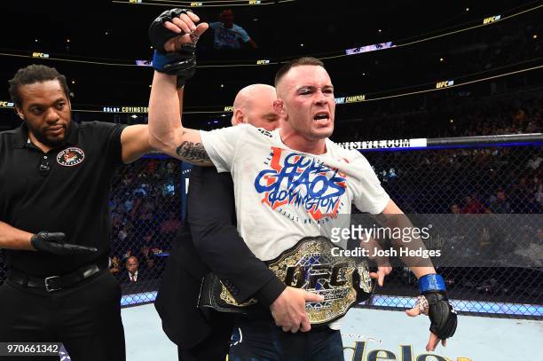 President Dana White places the interim welterweight championship belt on Colby Covington after defeating Rafael Dos Anjos of Brazil in their interim...