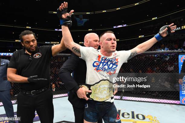 President Dana White places the interim welterweight championship belt on Colby Covington after defeating Rafael Dos Anjos of Brazil in their interim...