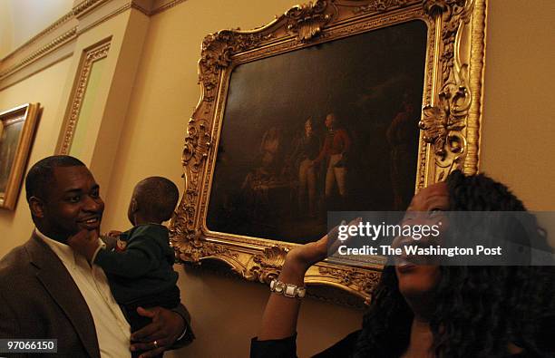 Michel du Cille The lone black man know as "the faithful negro servant" in a paintiing, titled, " General Marion Inviting a British Officer to Share...