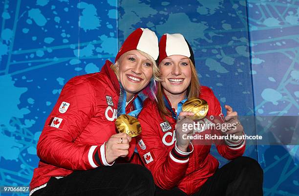 Kaillie Humphries and Heather Moyse of Canada celebrate receiving the gold medal during the medal ceremony for the women's two-man bobsleigh held at...