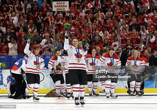 Captain Hayley Wickenheiser of Canada and her team celebrate after receiving the gold medal during the ice hockey women's gold medal game between...