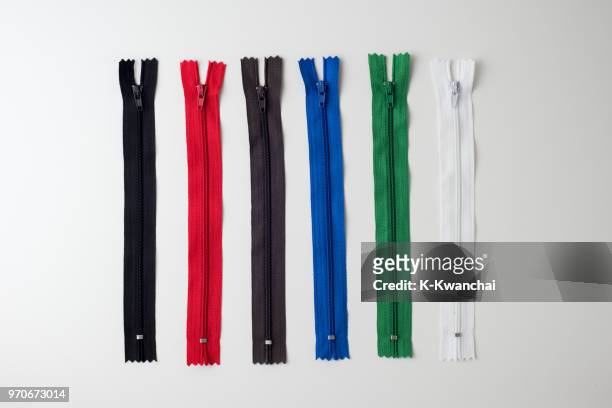 close-up of multi colored zipper over white background - zipper stock pictures, royalty-free photos & images