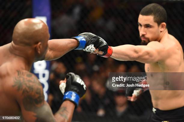 Robert Whittaker of New Zealand and Yoel Romero of Cuba touch gloves prior to their middleweight fight during the UFC 225 event at the United Center...