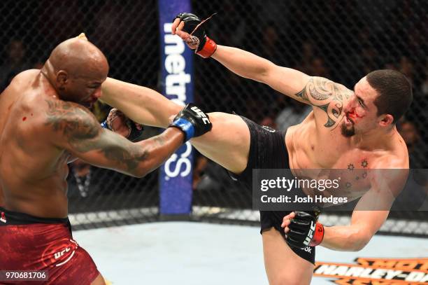 Robert Whittaker of New Zealand lands a kick to the head of Yoel Romero of Cuba in their middleweight fight during the UFC 225 event at the United...