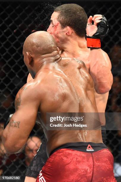 Yoel Romero of Cuba punches Robert Whittaker of New Zealand in their middleweight fight during the UFC 225 event at the United Center on June 9, 2018...