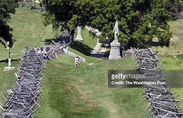 Kevin Clark\The Washington Post Neg #: 171691 Sharpsburg, MD Visitors walk the hollowed grounds of the Civil War Monday morning at the Antietam...