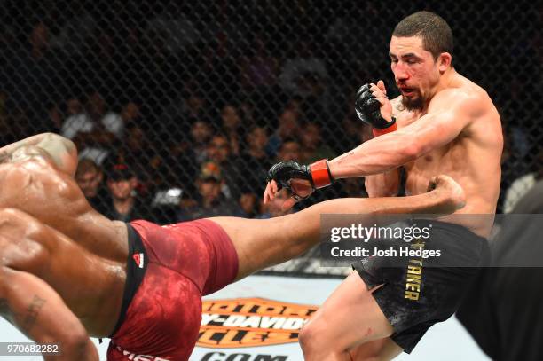 Yoel Romero of Cuba kicks Robert Whittaker of New Zealand in their middleweight fight during the UFC 225 event at the United Center on June 9, 2018...