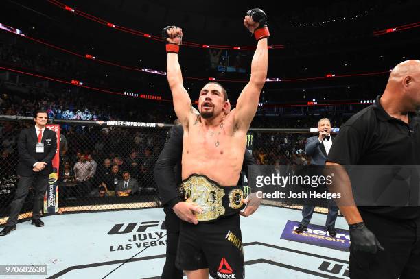 Robert Whittaker of New Zealand celebrates after defeating Yoel Romero of Cuba by split decision in their middleweight fight during the UFC 225 event...