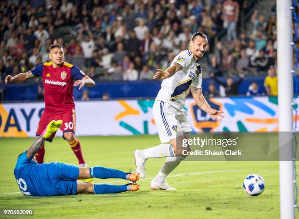 Zlatan Ibrahimovic of Los Angeles Galaxy battles past Nick Rimando of Real Salt Lake during the Los Angeles Galaxy's MLS match against FC Dallas at...
