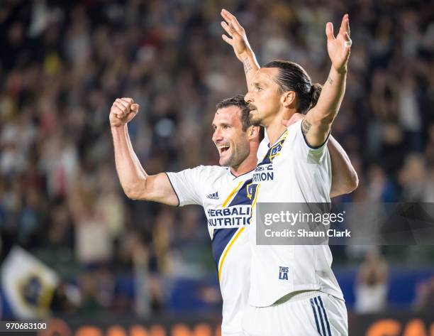 Zlatan Ibrahimovic of Los Angeles Galaxy celebrates his second goal of the game as Justen Glad of Real Salt Lake tries to defend during the Los...