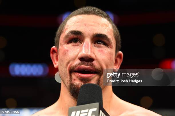 Robert Whittaker of New Zealand reacts after defeating Yoel Romero of Cuba in their middleweight fight during the UFC 225 event at the United Center...